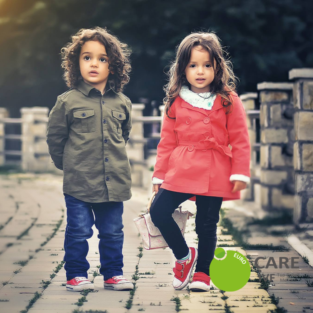 Gender selection north cyprus boy in green jacket; girl in pink jacket